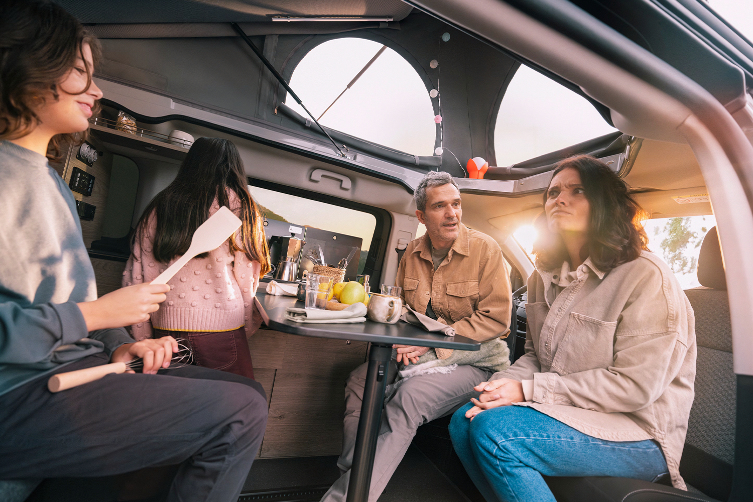 family of four sitting inside new citroen holidays