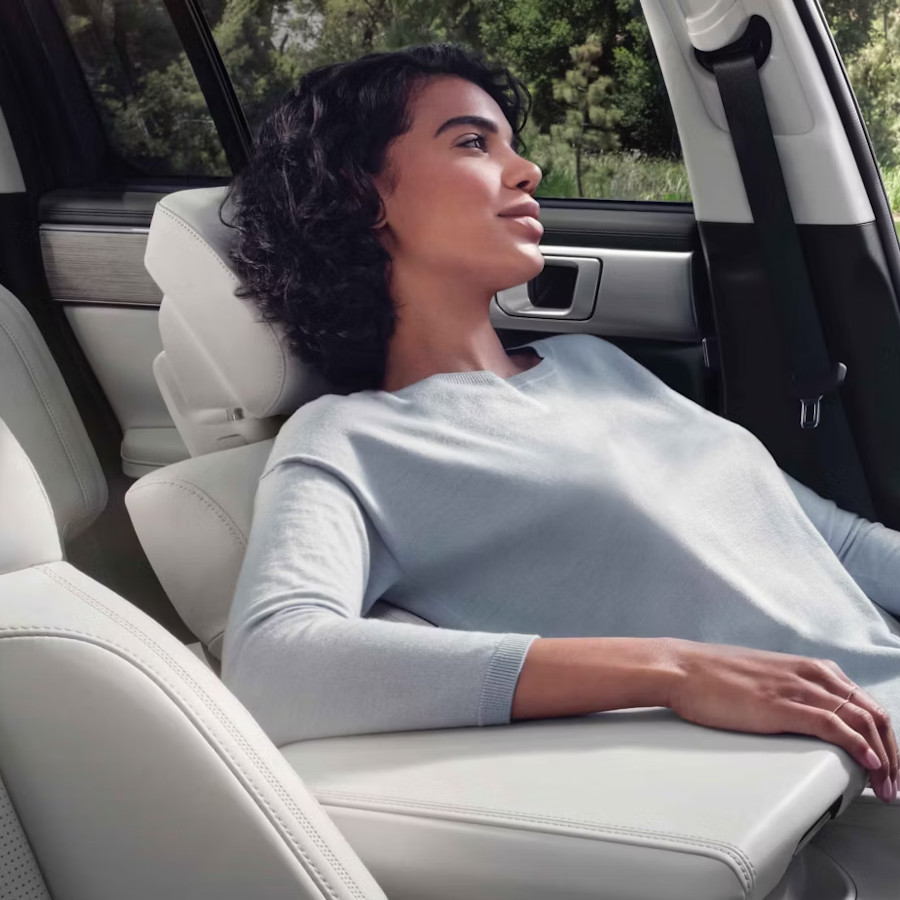 woman reclining in front seat
