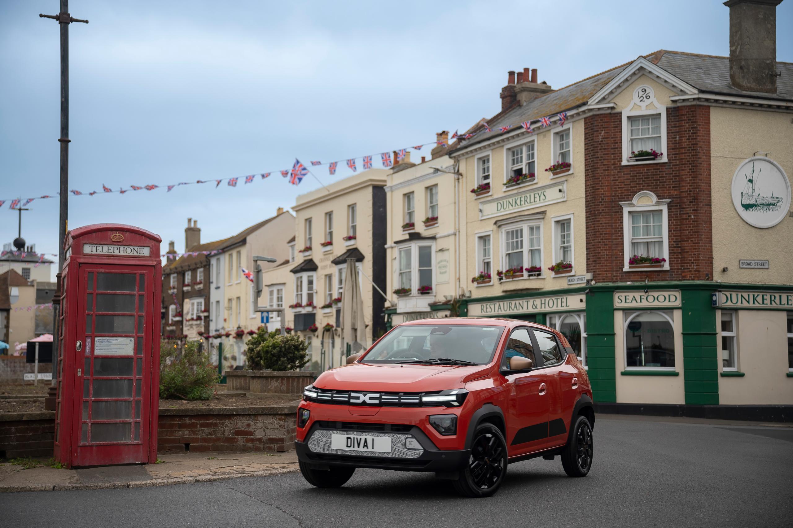 Dacia Spring parked in seaside town