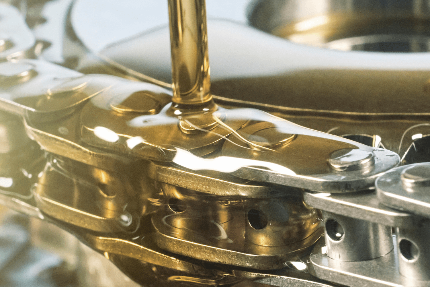 Engine timing chain being lubricated during Range Rover engine maintenance.