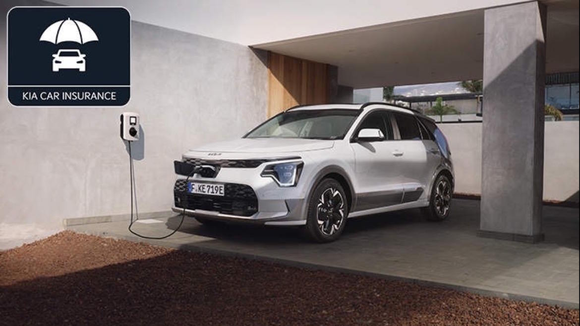Kia Car Insurance promotion displayed alongside a Kia electric vehicle charging at home.