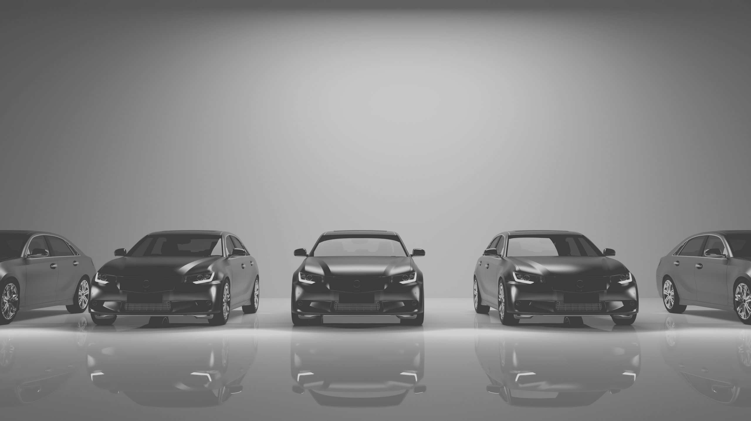 Cars lined up in black and white.