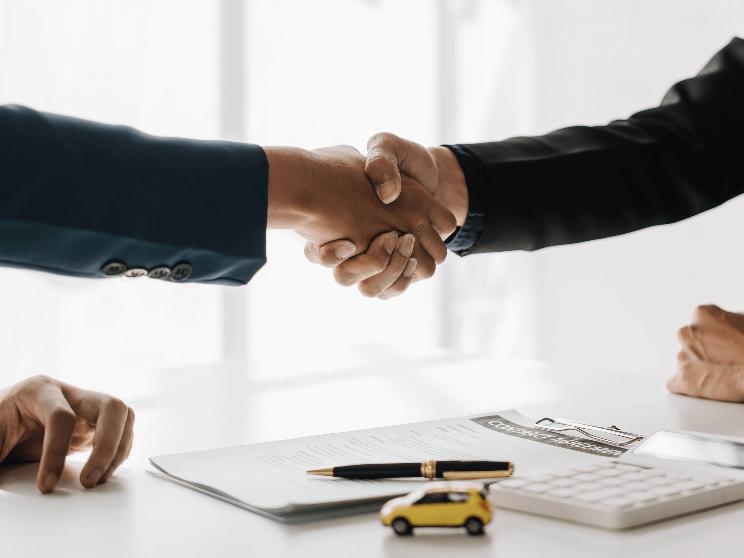 People shaking hands.