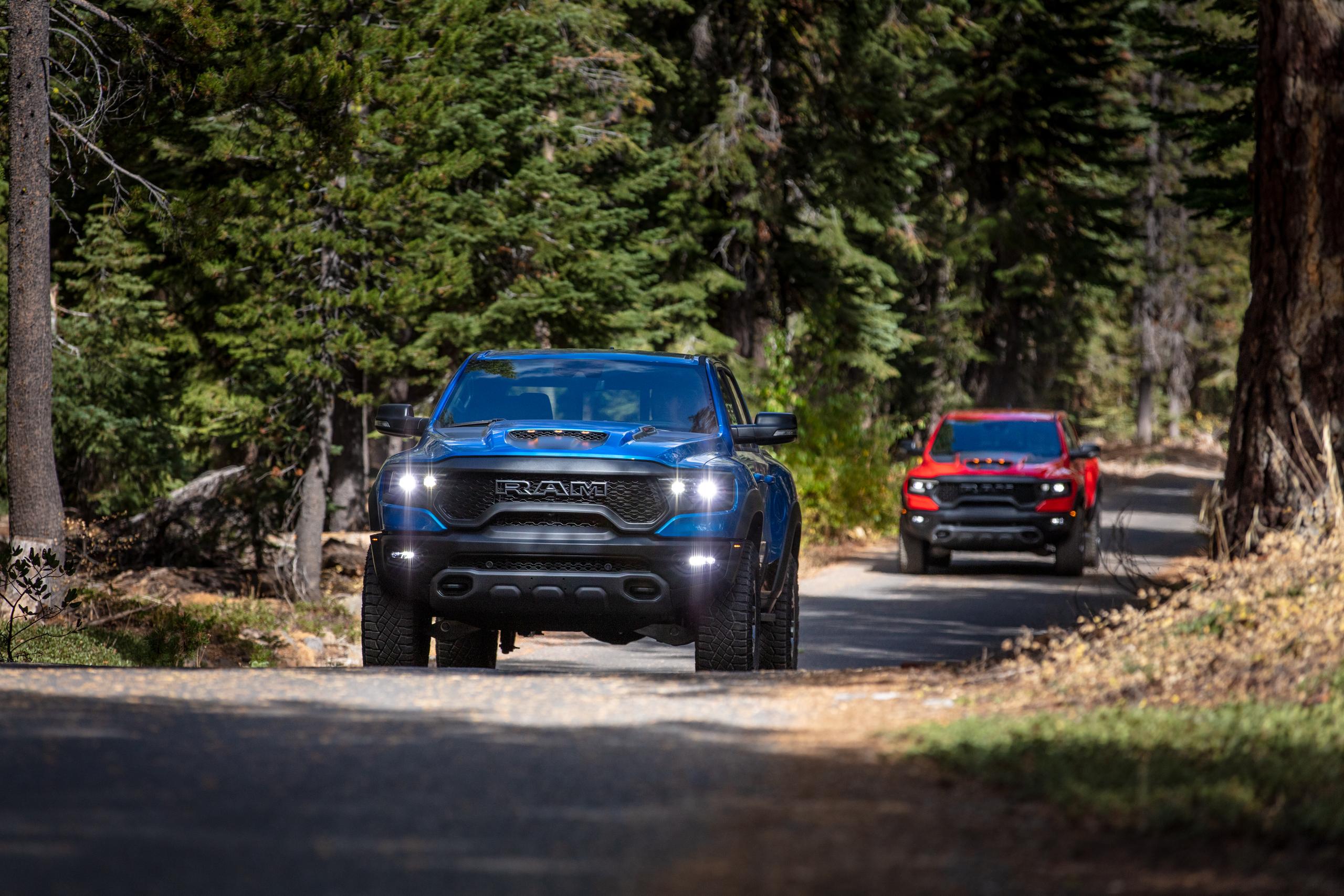 RAM Trucks driving through the forest