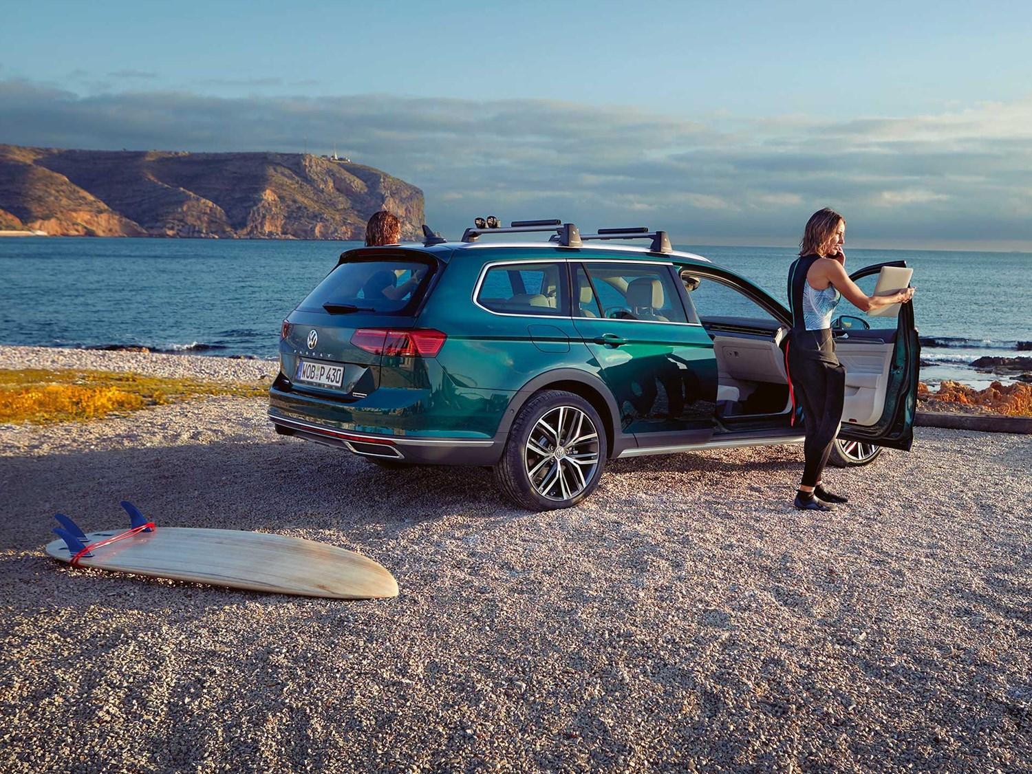 Volkswagen estate at beach with surfboard