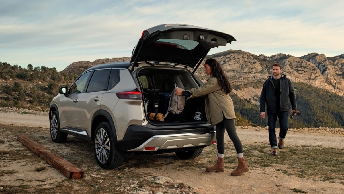 A parked Nissan X-trail car with the boot open, showing the large cargo capacity