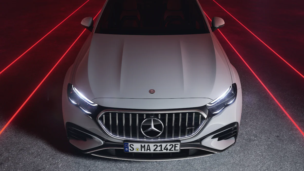 Front view of Mercedes-Benz with illuminated LED headlights.
