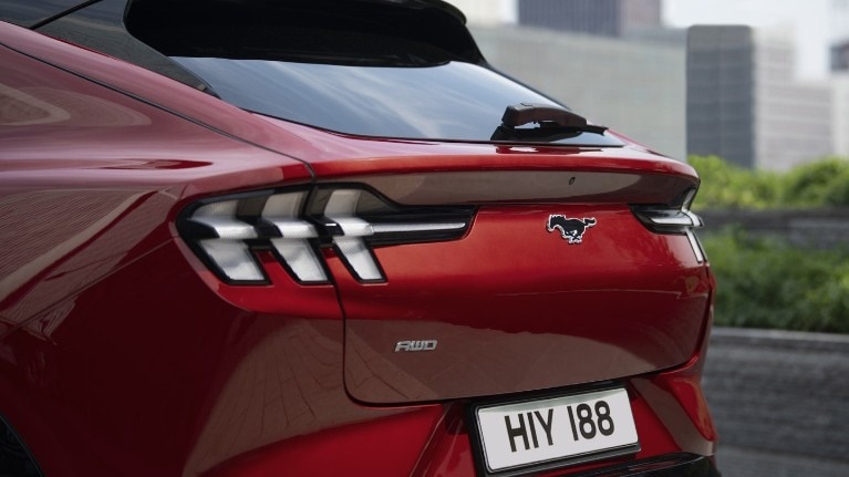 A Ford Mustang being charged via the FordPass app