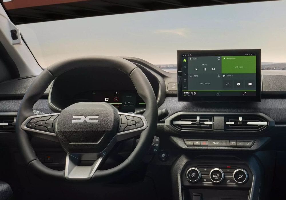 Dacia Sandero interior dashboard with steering wheel and central touchscreen display, highlighting infotainment system and controls.