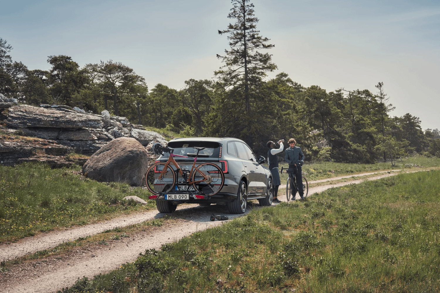 Volvo SUV with rear-mounted bicycle carrier.