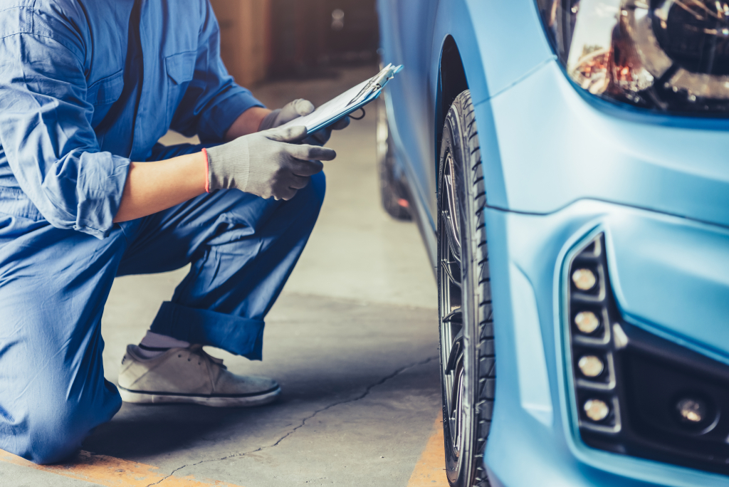 Technician checking car