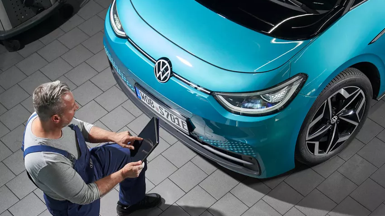 Mechanic inspecting Volkswagen Bonnet