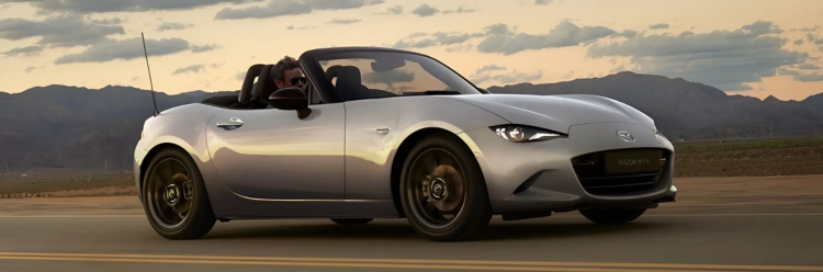 Grey Mazda MX-5 driving shot