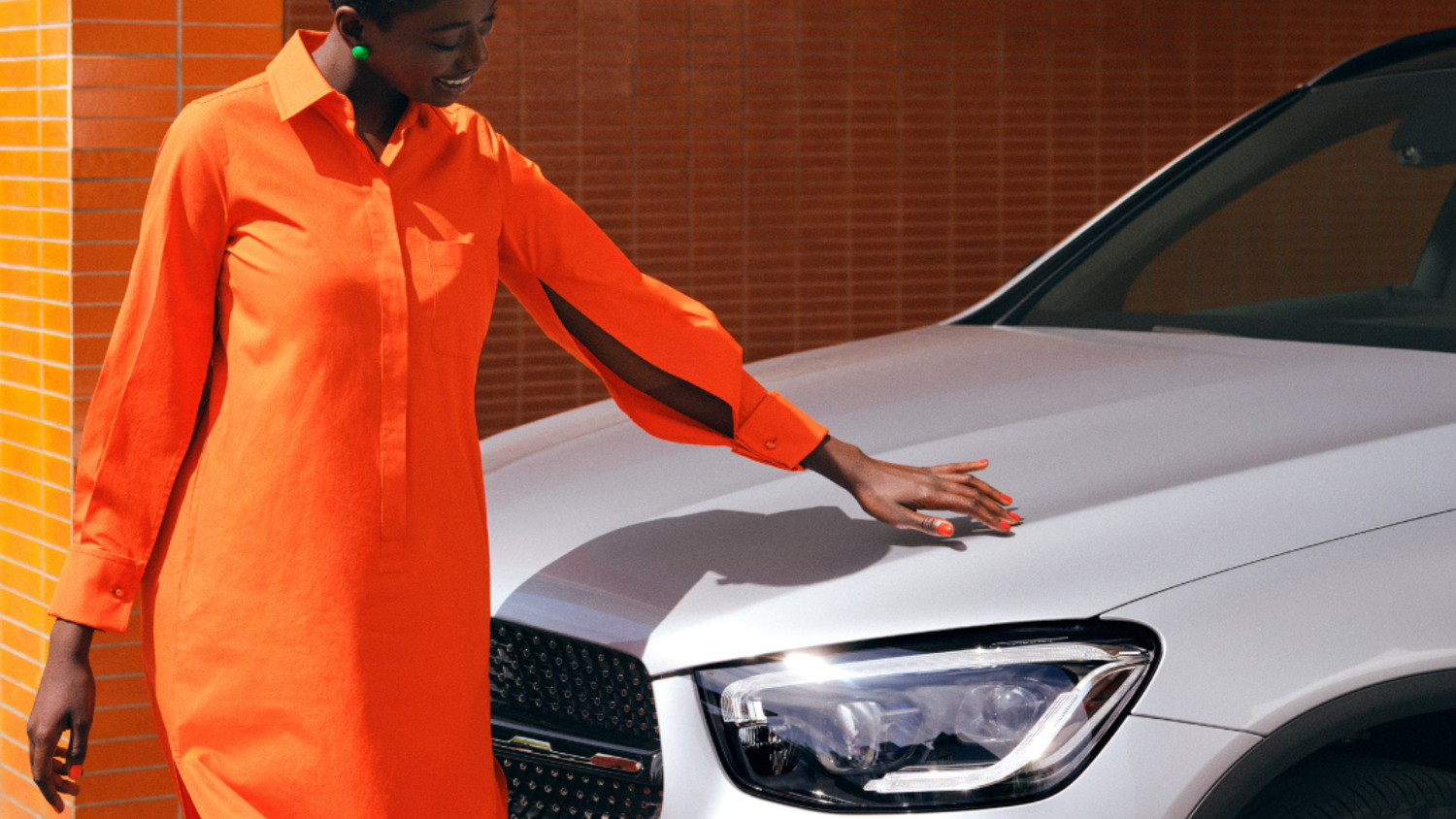 Person by White Mercedes-Benz Vehicle