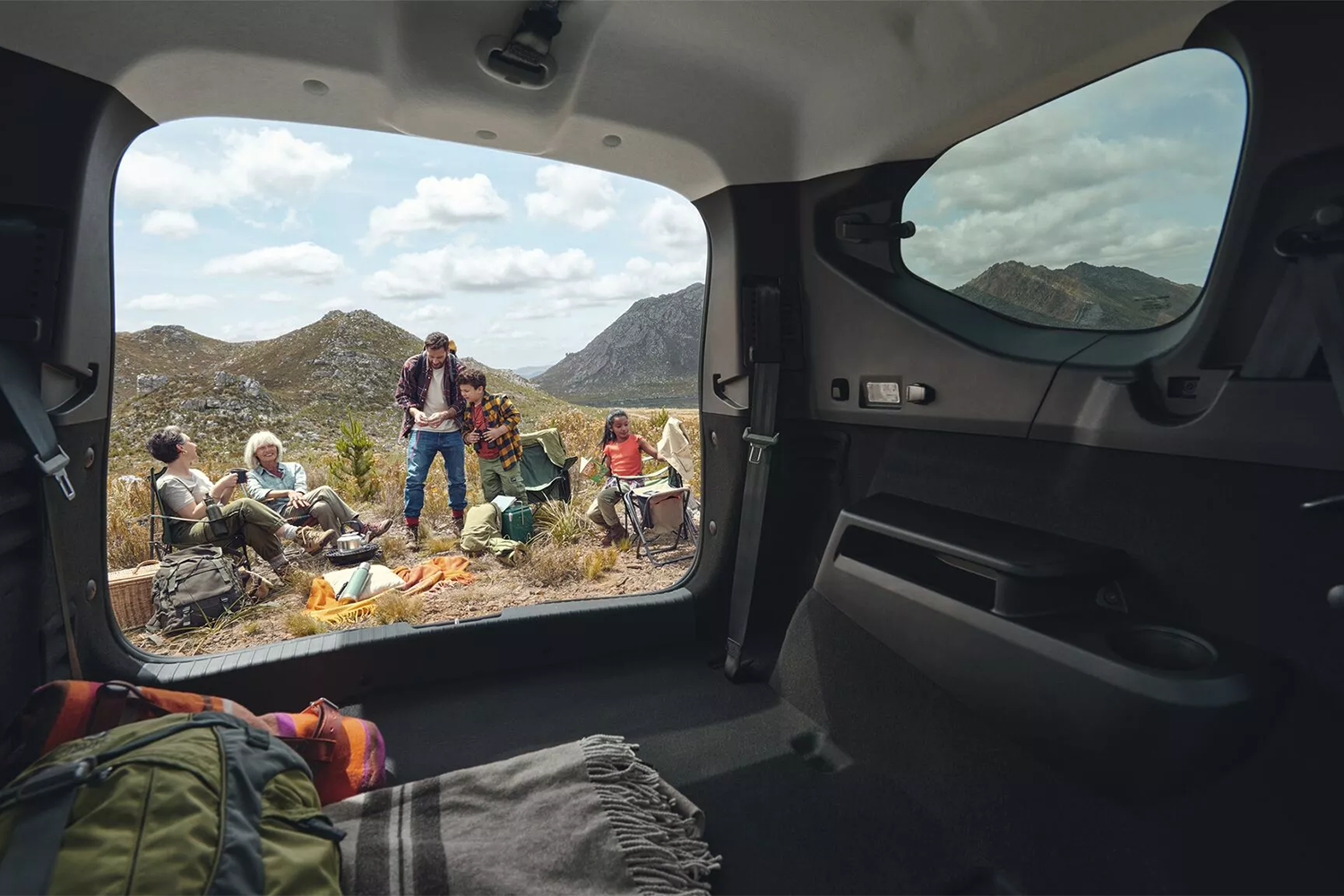 People Camping outside Dacia Jogger