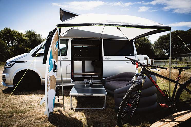 VW Transporter camper conversion set up at campsite