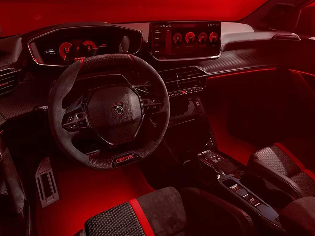 Peugeot E-208 GTi interior featuring the Peugeot i-Cockpit, digital driver display, GTi sports steering wheel and driver-focused cabin design.