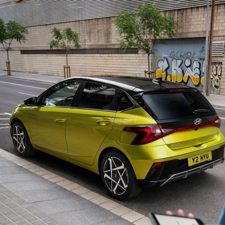 i20 parked infront of graffiti wall