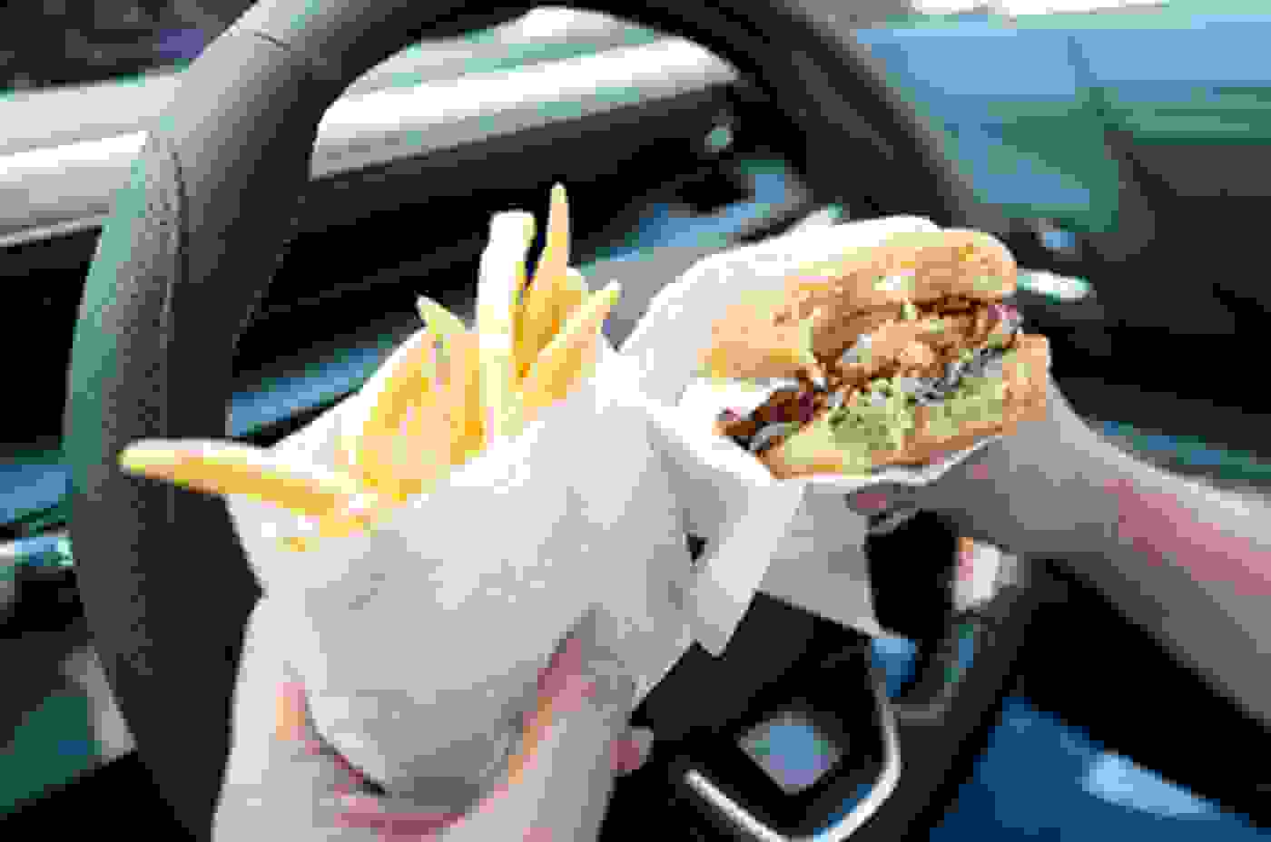 Taking Both Hands off the Wheel to Eat and Drink is an Offence