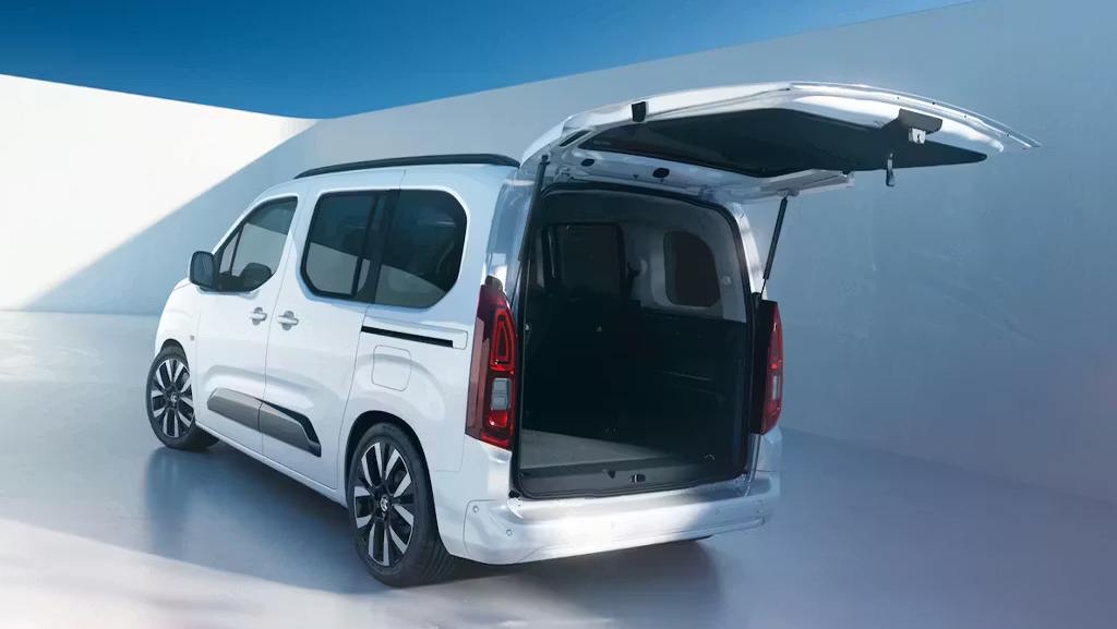 White Vauxhall Combo showcasing its spacious boot area with the tailgate open.