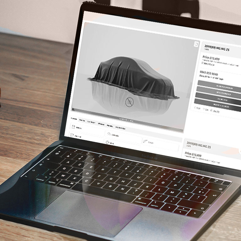 Laptop showing car dealership app.