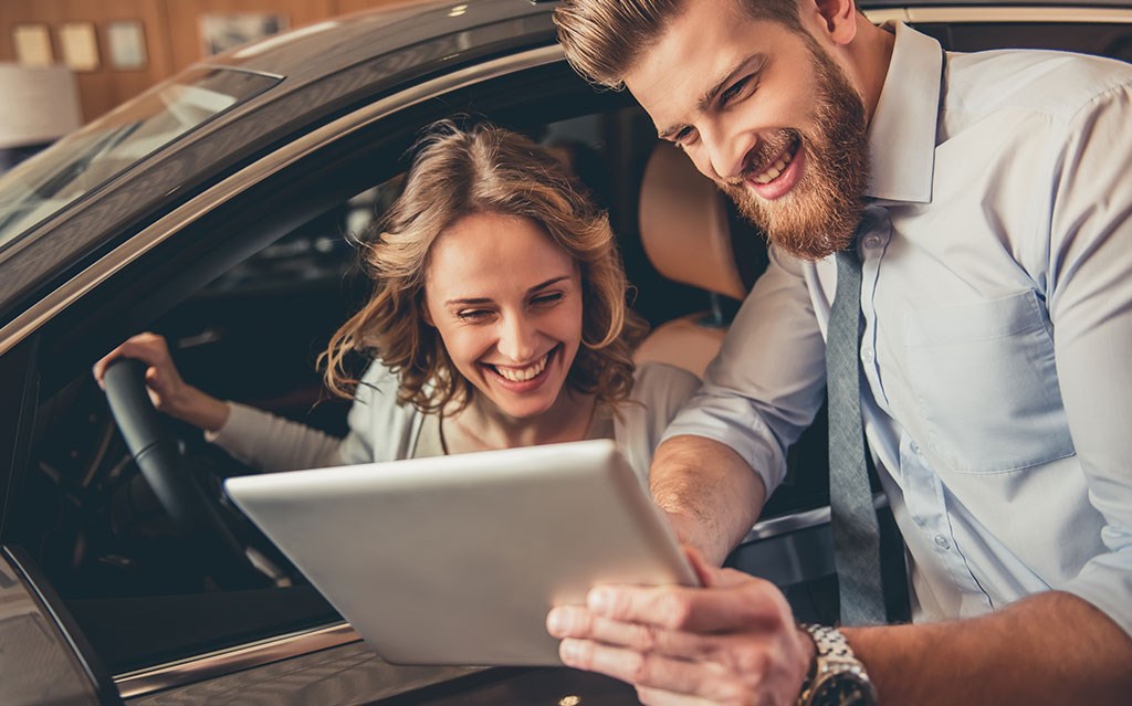 Man and woman looking at ipad