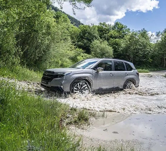 Subaru Forester driving through the water