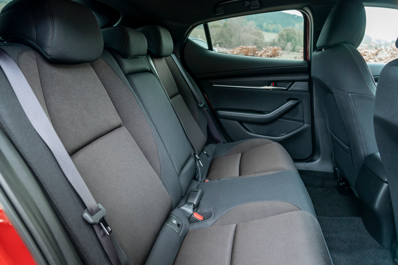 The rear seats within a new Mazda3 car