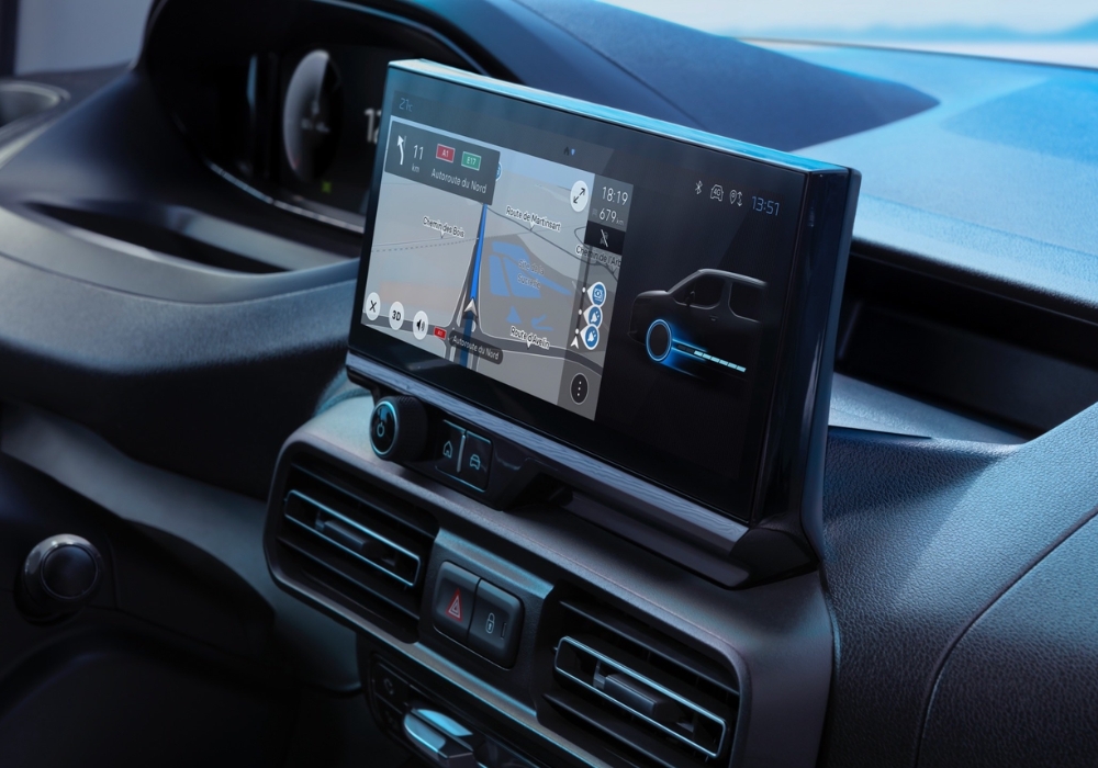 Peugeot e-Partner dashboard touchscreen displaying navigation and vehicle energy information.