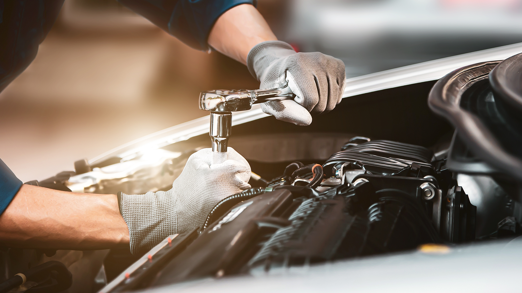 Mechanic Working On Vehicle