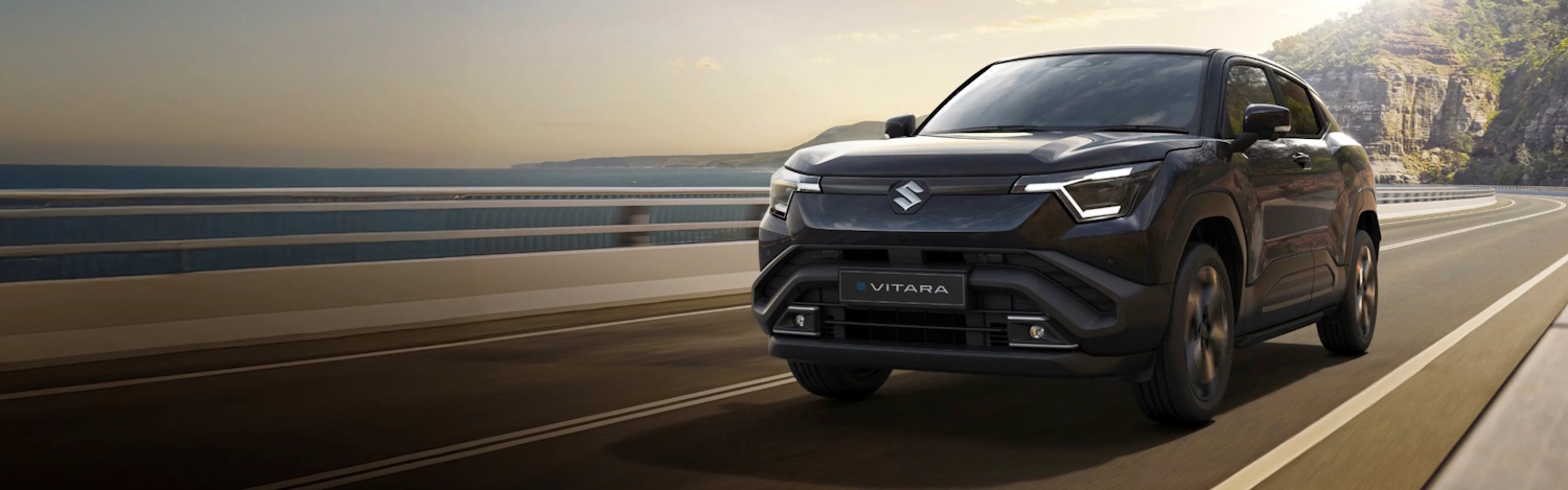 black suzuki e-vitara on the high way