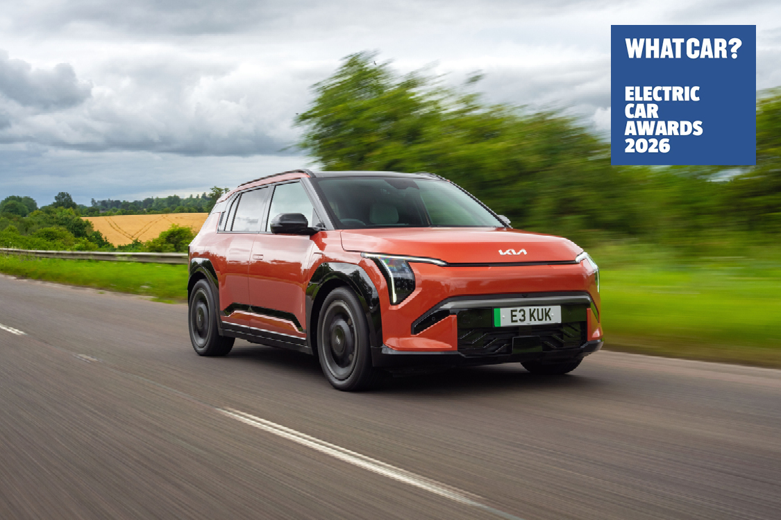 Red Kia EV3 driving down motorway