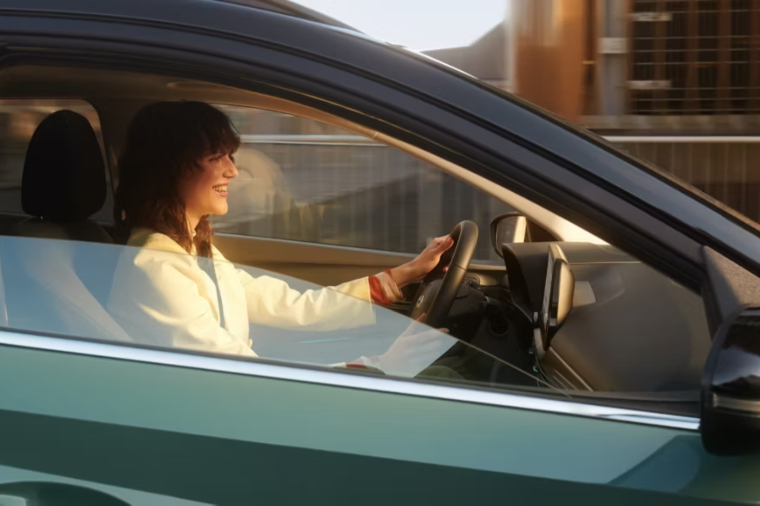 side view of woman in driving seat