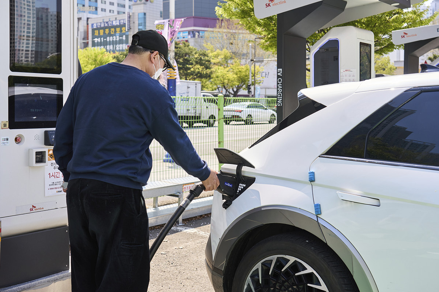 man putting his IONIQ 5 on charge