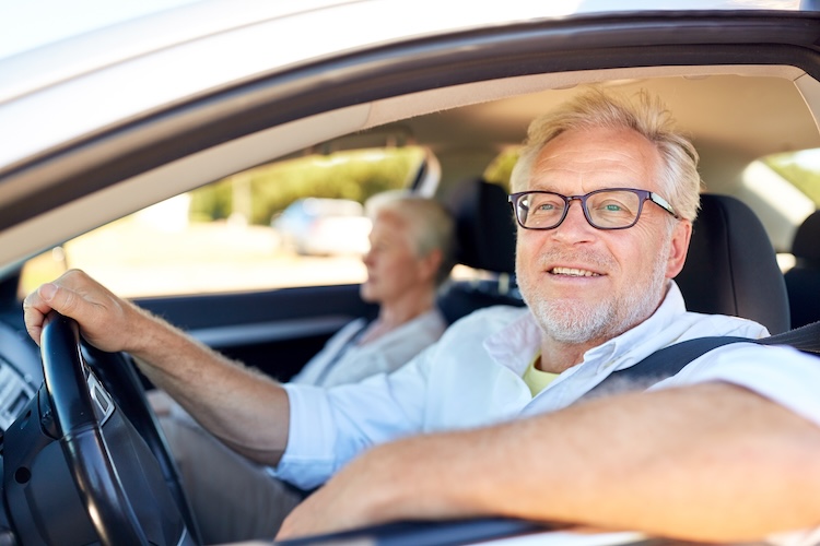 Senior couple driving