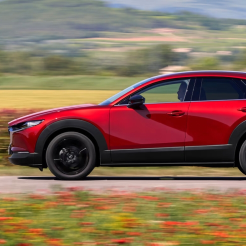 Mazda CX-30 in red exterior side view