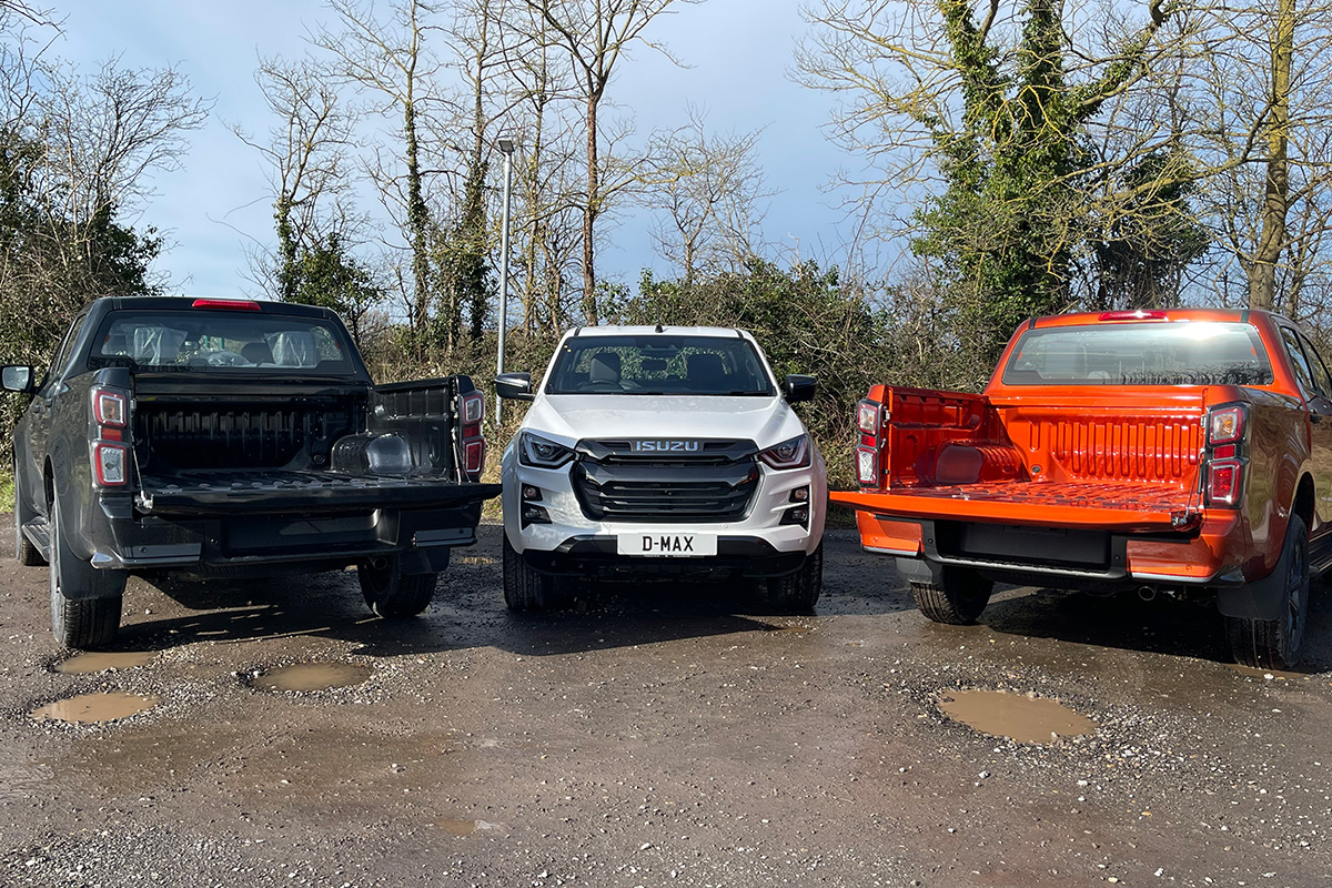 3 isuzu trucks various angles