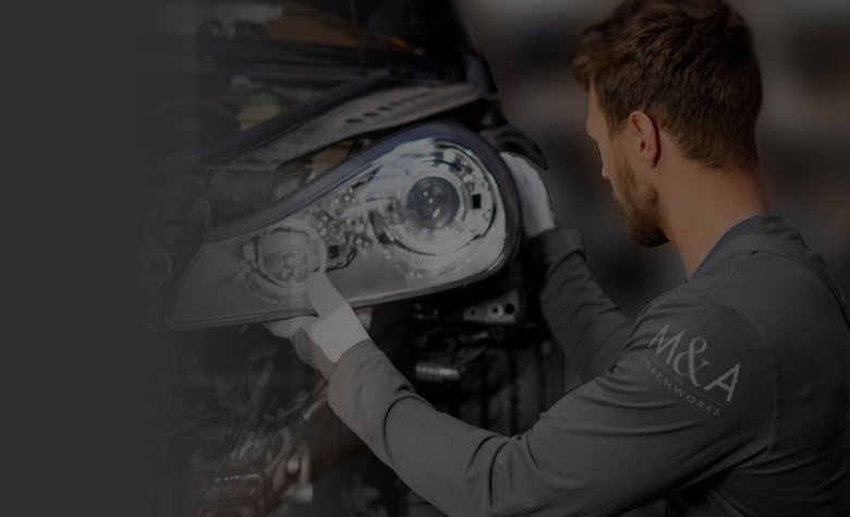 Man fitting headlight 