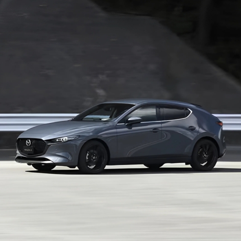 Mazda3 Hatchback in grey driving shot